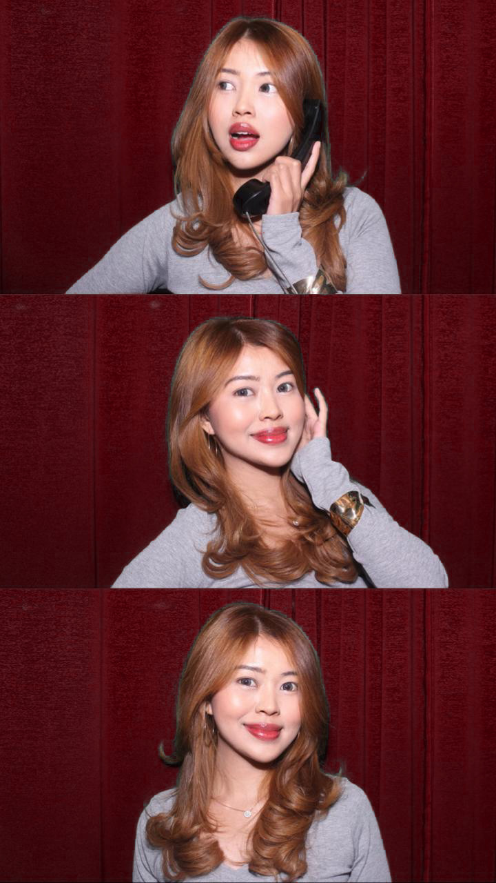 Photobooth strip of Ericha on a vintage phone, smiling and waving hello